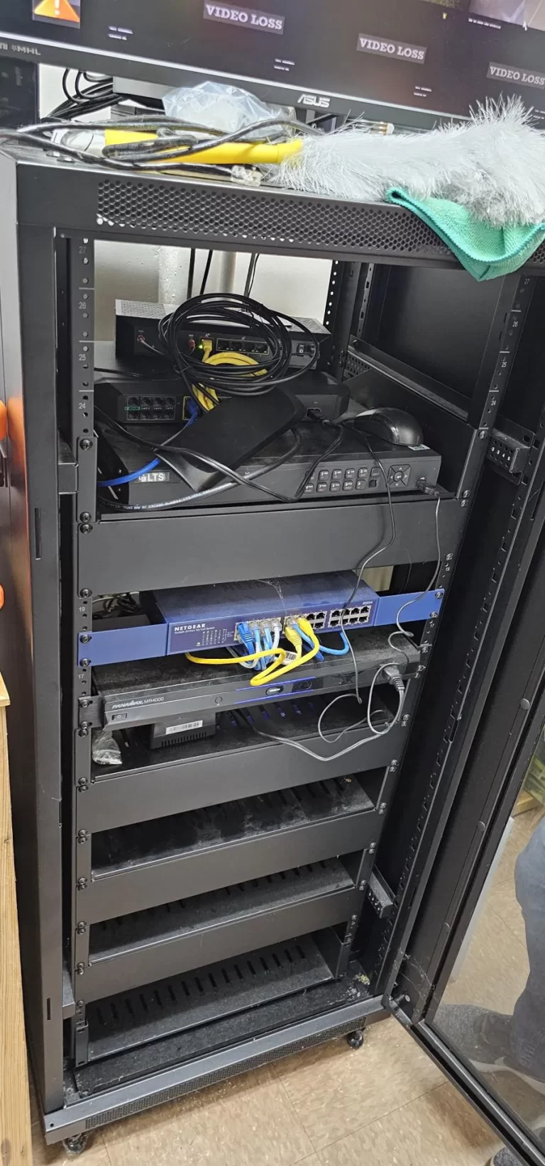 Open equipment rack before SpaceCenter Systems rework at Keep Pearland Beautiful